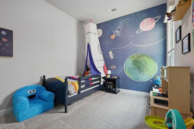 bedroom featuring baseboards, visible vents, and carpet