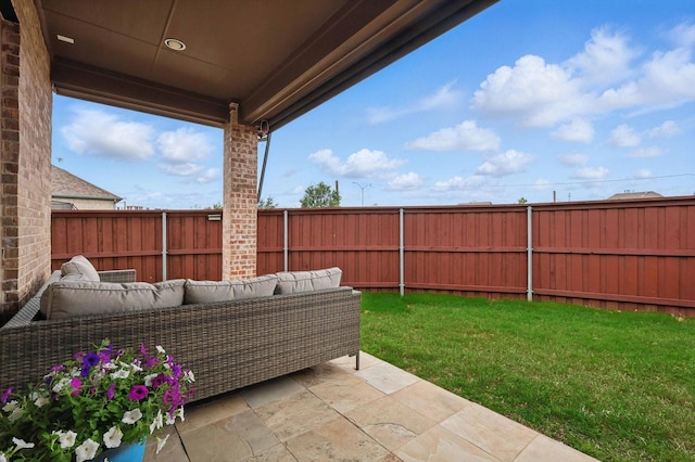 view of patio / terrace featuring an outdoor hangout area and a fenced backyard