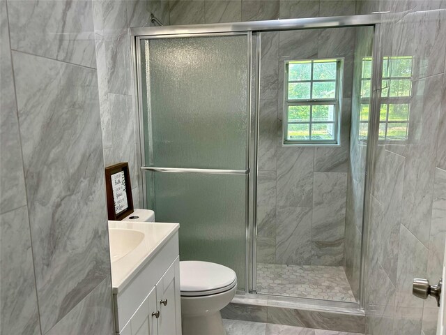 3408 Michigan Ave, Dallas, TX 75216 - full bath with vanity, a shower stall, and toilet