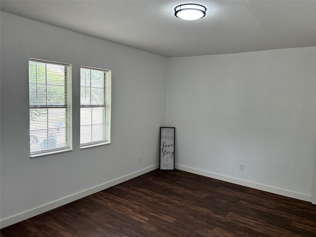 3408 Michigan Ave, Dallas, TX 75216 - empty room featuring baseboards and dark wood-type flooring