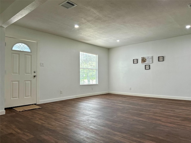 3408 Michigan Ave, Dallas, TX 75216 - foyer entrance with recessed lighting, baseboards, visible vents, and dark wood finished floors