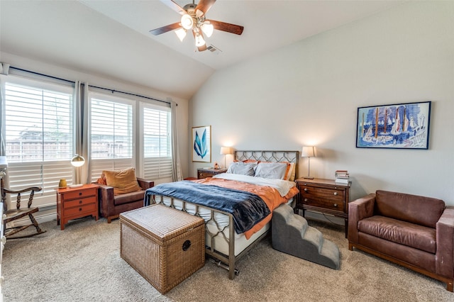 bedroom with carpet floors, a ceiling fan, vaulted ceiling, and visible vents