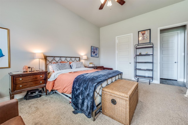 carpeted bedroom featuring baseboards, ceiling fan, and vaulted ceiling
