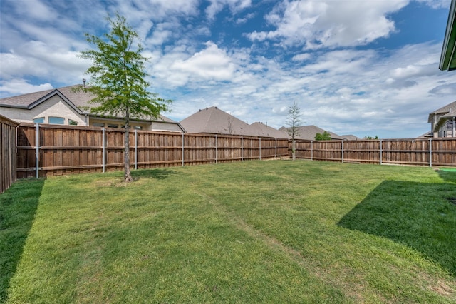 view of yard with a fenced backyard