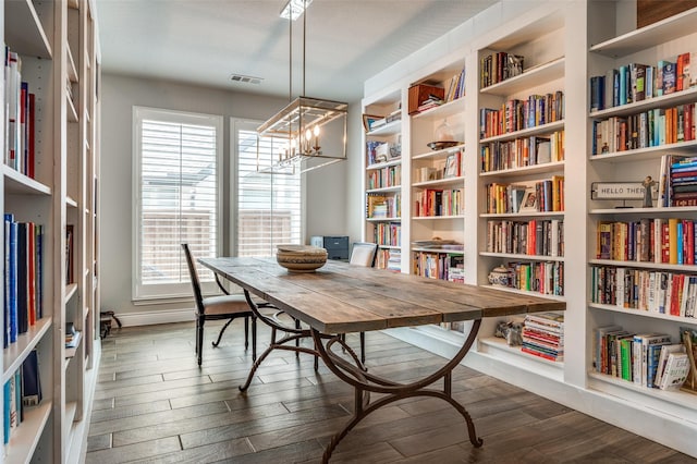 interior space featuring visible vents and dark wood-style floors