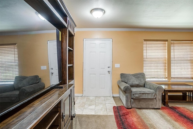 4214 Landrum Ave, Dallas, TX 75216 - foyer featuring ornamental molding, light colored carpet, light tile patterned flooring, and baseboards
