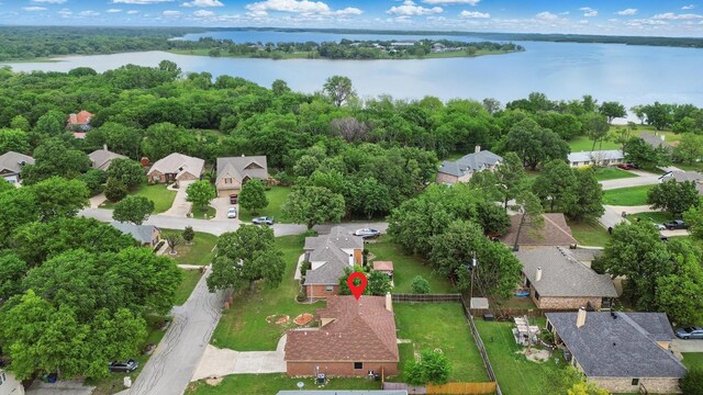 birds eye view of property with a water view and a residential view
