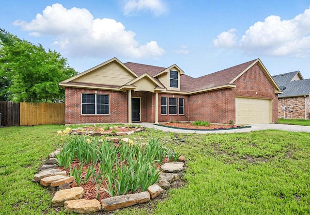 view of front of home featuring brick siding, an attached garage, fence, and a front yard