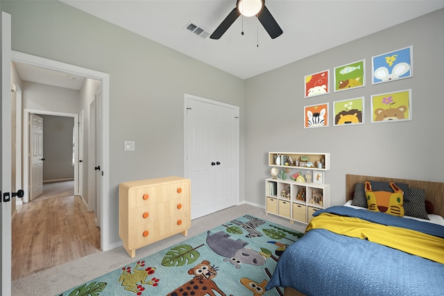bedroom featuring carpet flooring, baseboards, visible vents, and ceiling fan