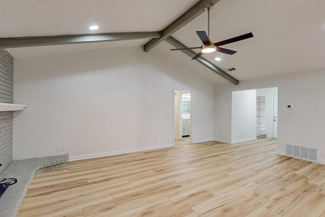 unfurnished living room with visible vents, wood finished floors, baseboards, lofted ceiling with beams, and a ceiling fan