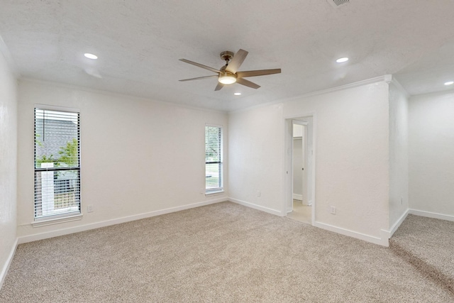 unfurnished room with a healthy amount of sunlight, ceiling fan, light carpet, and recessed lighting