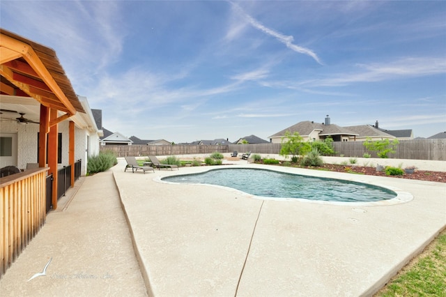 view of pool with a fenced in pool, a fenced backyard, a patio area, and a residential view