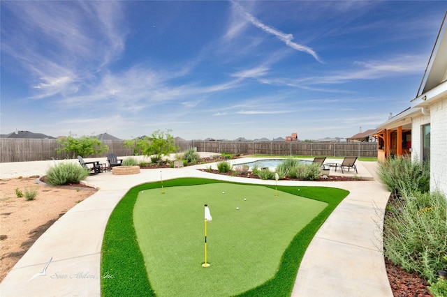 surrounding community with a patio, a fenced backyard, and a fire pit