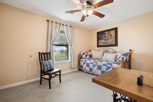 carpeted bedroom featuring baseboards and ceiling fan