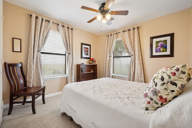 bedroom with carpet flooring, a ceiling fan, and baseboards