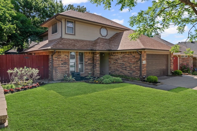 traditional home featuring brick siding, an attached garage, fence, and a front lawn