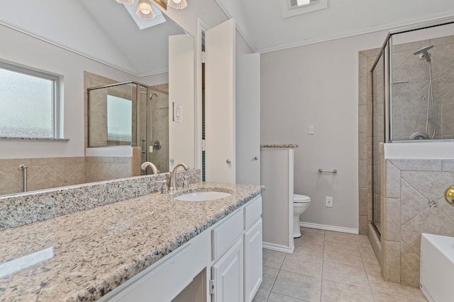 bathroom with tile patterned flooring, vanity, a ceiling fan, a shower stall, and lofted ceiling