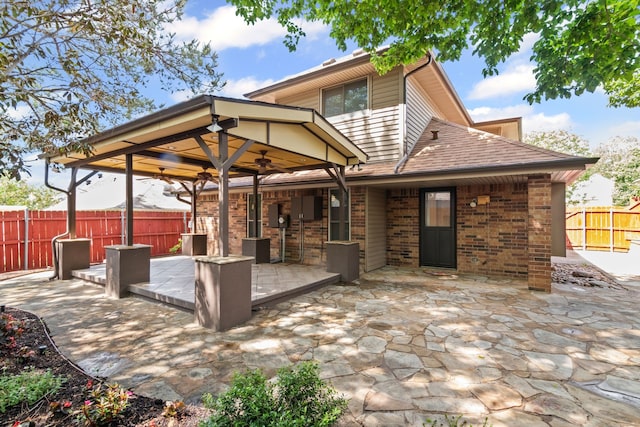 view of patio / terrace featuring a fenced backyard and a ceiling fan