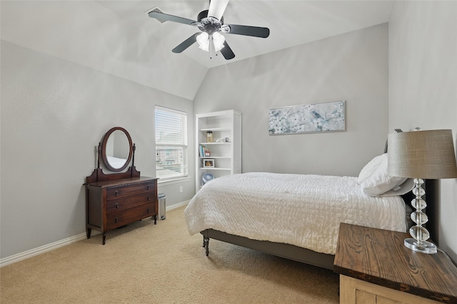 bedroom with a ceiling fan, baseboards, light colored carpet, and lofted ceiling
