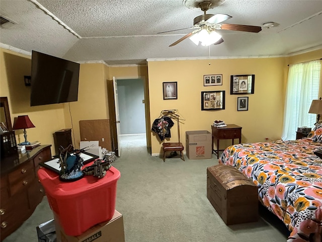 carpeted bedroom featuring a ceiling fan, a textured ceiling, and visible vents