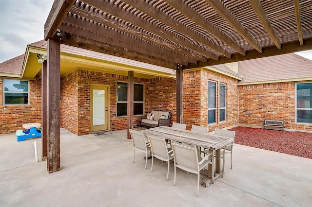 view of patio with a pergola and outdoor dining space