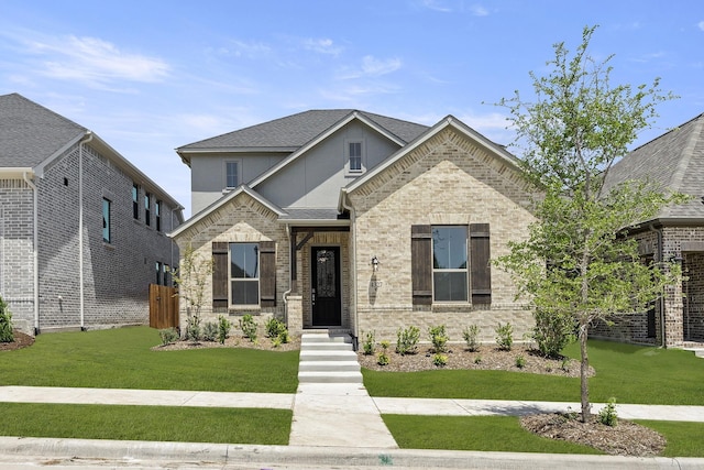 4327 Hudson St, Fate, TX 75087 - view of front of house with stucco siding, brick siding, and a shingled roof