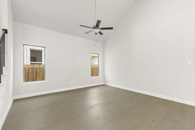 4327 Hudson St, Fate, TX 75087 - spare room featuring a ceiling fan, dark wood-type flooring, high vaulted ceiling, and baseboards