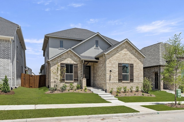 4327 Hudson St, Fate, TX 75087 - view of front facade with roof with shingles and brick siding