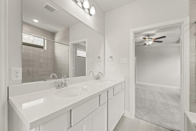 4327 Hudson St, Fate, TX 75087 - bathroom with a ceiling fan, double vanity, baseboards, and a shower stall