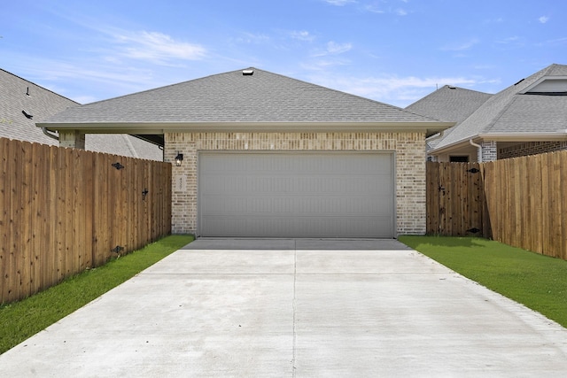 4327 Hudson St, Fate, TX 75087 - view of front of house with brick siding, concrete driveway, roof with shingles, and an attached garage