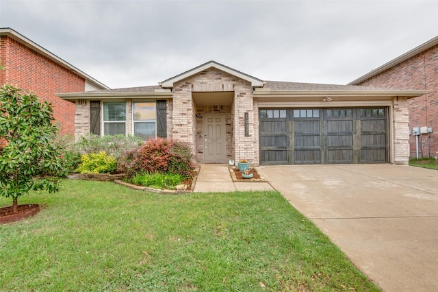 ranch-style house with a garage, concrete driveway, a front lawn, and brick siding
