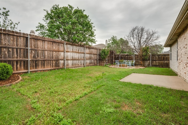 view of yard with a patio and a fenced backyard
