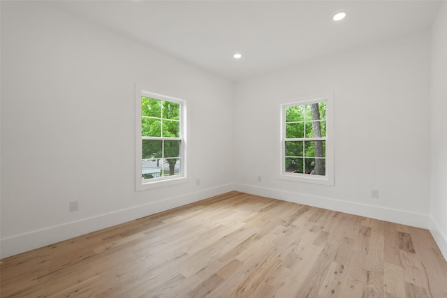 4401 El Campo Ave, Fort Worth, TX 76107 - unfurnished room featuring plenty of natural light, baseboards, light wood-style flooring, and recessed lighting