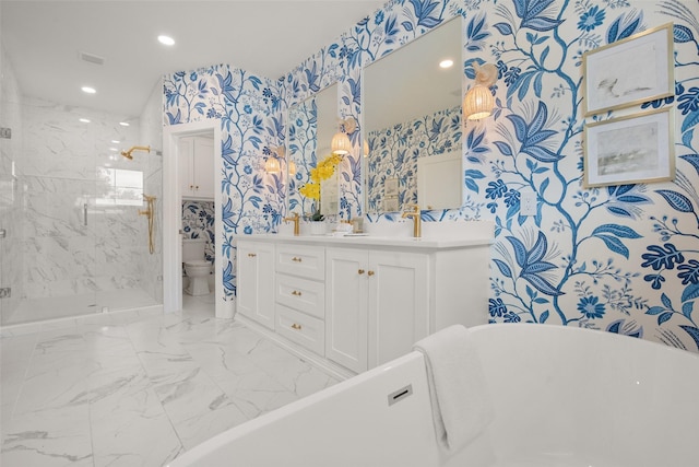 bathroom featuring double vanity, toilet, a marble finish shower, marble finish floor, and wallpapered walls
