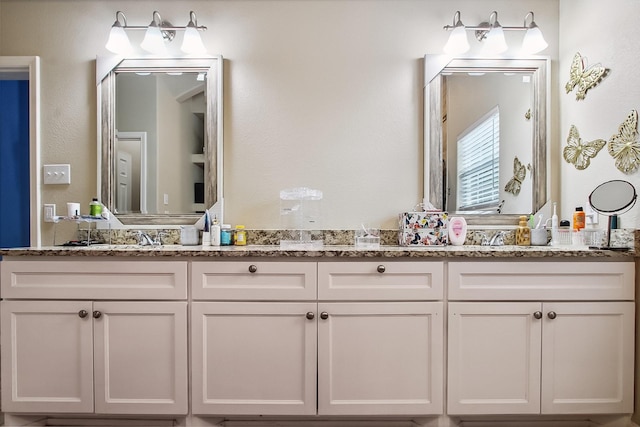 4713 Garrison Ave, Dallas, TX 75216 - full bathroom with double vanity and a sink