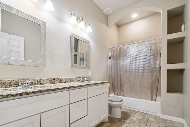 4713 Garrison Ave, Dallas, TX 75216 - bathroom featuring visible vents, shower / tub combo with curtain, double vanity, toilet, and a sink