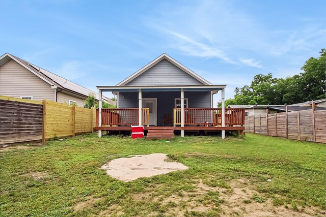 4713 Garrison Ave, Dallas, TX 75216 - rear view of property with a lawn, a fenced backyard, and a wooden deck