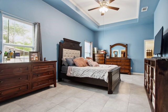 4713 Garrison Ave, Dallas, TX 75216 - bedroom with visible vents, baseboards, a tray ceiling, a ceiling fan, and light tile patterned floors