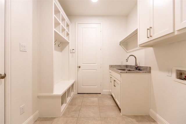 5521 Riverside Ln, Mckinney, TX 75070 - clothes washing area featuring a sink, baseboards, cabinet space, and hookup for a washing machine