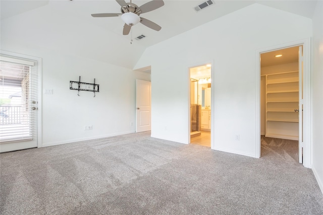 5521 Riverside Ln, Mckinney, TX 75070 - unfurnished bedroom with vaulted ceiling, a spacious closet, carpet flooring, and visible vents