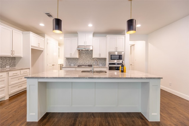 5521 Riverside Ln, Mckinney, TX 75070 - kitchen featuring decorative backsplash, visible vents, appliances with stainless steel finishes, a sink, and white cabinets