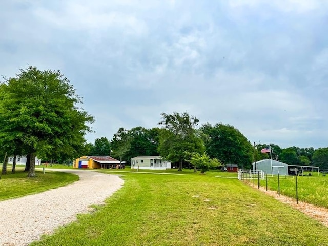 TBD County Road 891, Jewett, TX 75846 - view of community featuring a lawn, fence, and gravel driveway