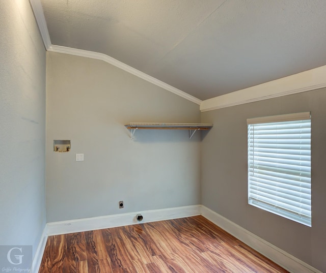 laundry room featuring washer hookup, hookup for an electric dryer, laundry area, crown molding, and wood finished floors