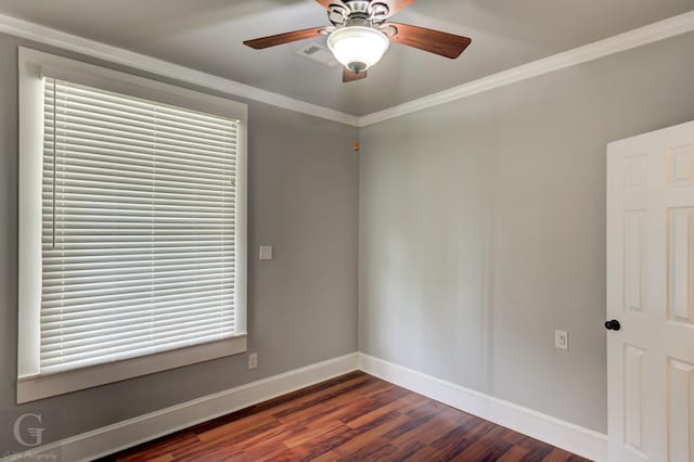 unfurnished room with a ceiling fan, baseboards, wood finished floors, visible vents, and ornamental molding