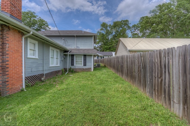 view of yard featuring cooling unit and fence private yard