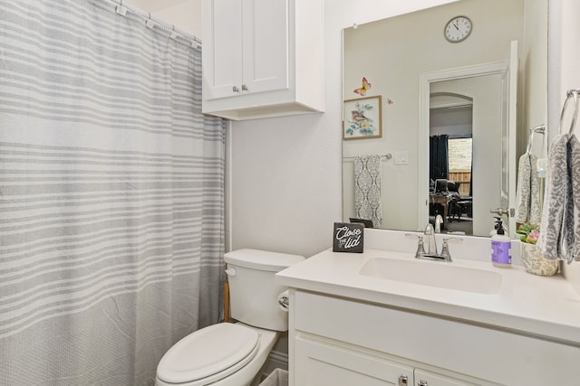 full bathroom with vanity and toilet