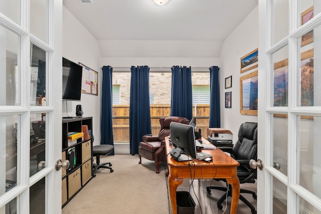 office featuring french doors, carpet flooring, and lofted ceiling