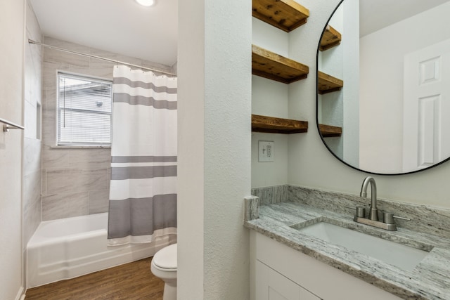 full bath with vanity, shower / bath combo, toilet, and wood finished floors