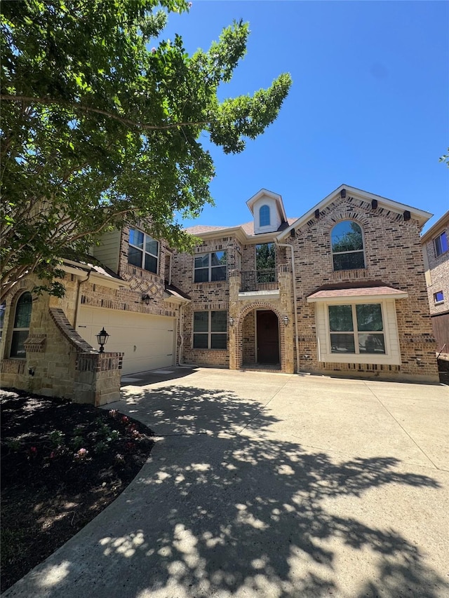 2823 Millington Dr, Highland Village, TX 75077 - view of front of property with an attached garage, concrete driveway, and brick siding