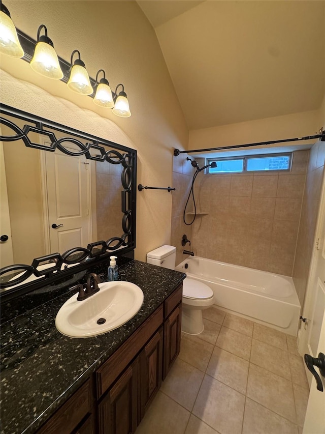 2823 Millington Dr, Highland Village, TX 75077 - full bathroom with lofted ceiling, shower / washtub combination, vanity, toilet, and tile patterned floors
